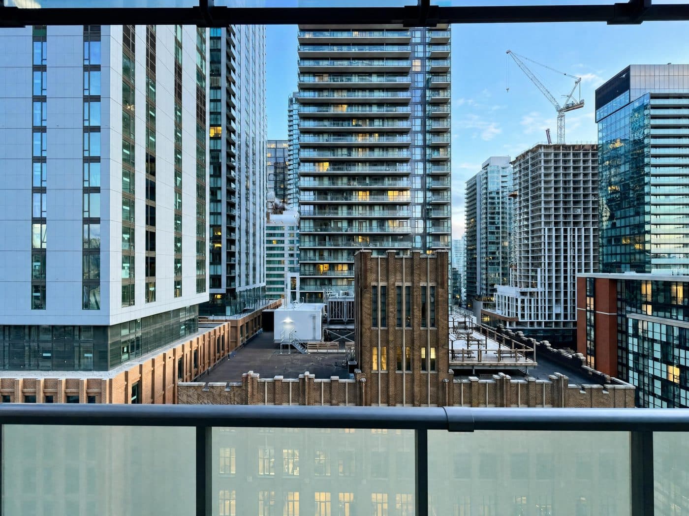 Downtown Toronto skyline seen from the balcony of a RivetStays-managed suite at The Peter, 101 Peter St